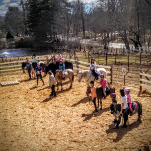 Summer campers ready for horseback riding lesson.