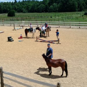Group ride in arena. Archie, Bella, Starbuck Ray & students