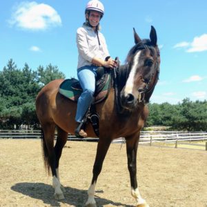 Jackie, shown in western gear, is a favorite teacher for students.